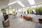 What is the difference between a house extension and a conservatory?