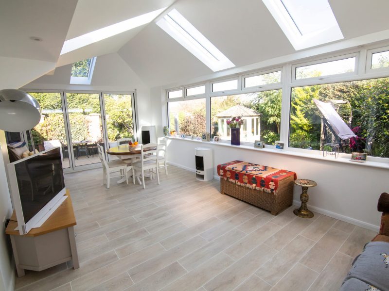What is the difference between a house extension and a conservatory?